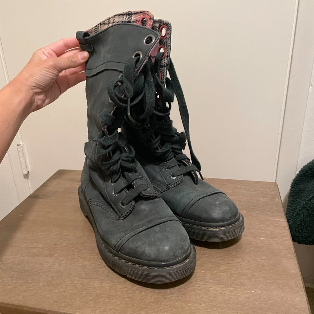 Dr. Martens black leather boots with plaid interior